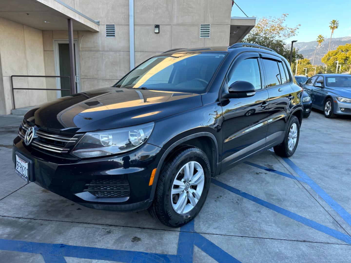 2016 Black /Black Volkswagen Tiguan (WVGAV7AX5GW) , AUTOMATIC transmission, located at 30 S. Berkeley Avenue, Pasadena, CA, 91107, (626) 248-7567, 34.145447, -118.109398 - Crown City Motors is a used “Buy Here Pay Here” car dealer in Pasadena CA. “Buy Here Pay Here” financing, means that when you purchase your vehicle from our dealership, that you make the payments to the dealership as well. We do not need the banks approval to get you approved for a used auto - Photo#1